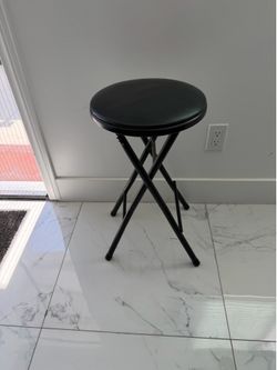 Padded black desk stool