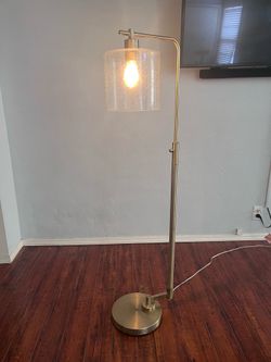 Floor lamp with glass shade