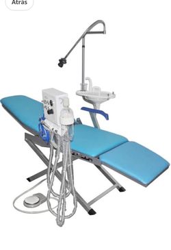 Unidad de odontologia con motor para piezas de mano, jeringa triple, mesa auxiliar,y silla