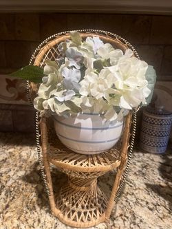 Wicker stand with fake plant
