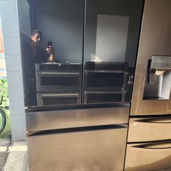 This Samsung refrigerator has a 36-inch wide screen, is 68 and a half inches tall, and 29 inches deep. It is brand new.