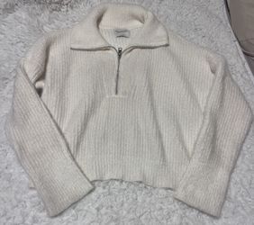 Elegant cream turtleneck sweater.