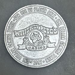 Vintage Whiskey Pete's $1 one dollar casino gaming token from 1987