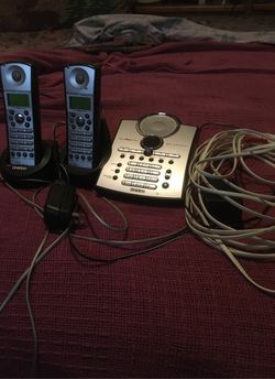 Uniden landline phone with extra long cord and portable extra phone and cradle