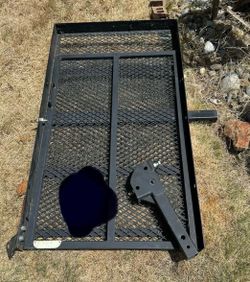 Hitch mounted cargo carrier with full down side ramp