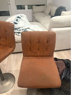 2 Brown height adjustable barstool chairs