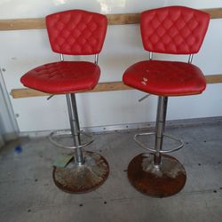 2 RED LEATHER BAR STOOLS