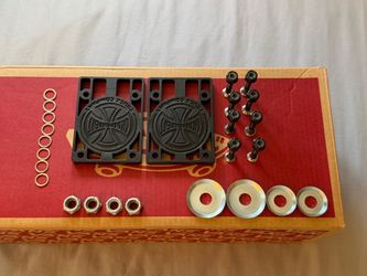 Skateboard riser pads and hardware