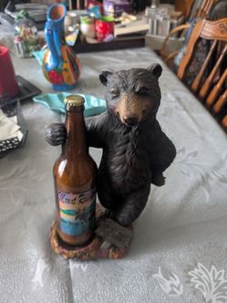 Bear statue with bottle