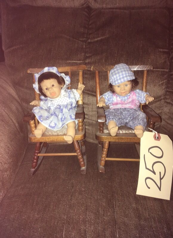 Small dolls in rockers