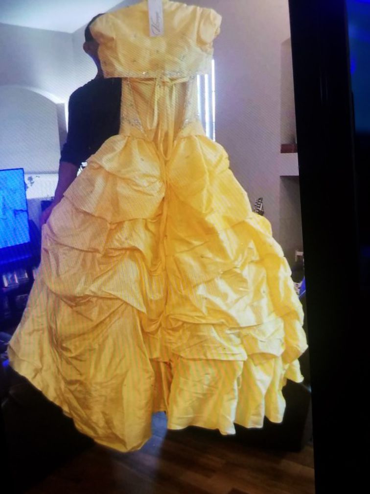 Quinceanera dress inspired by the beauty and the beast size 2 small yellow practically brand new only used couple hours. we paid $500.00 I want $250