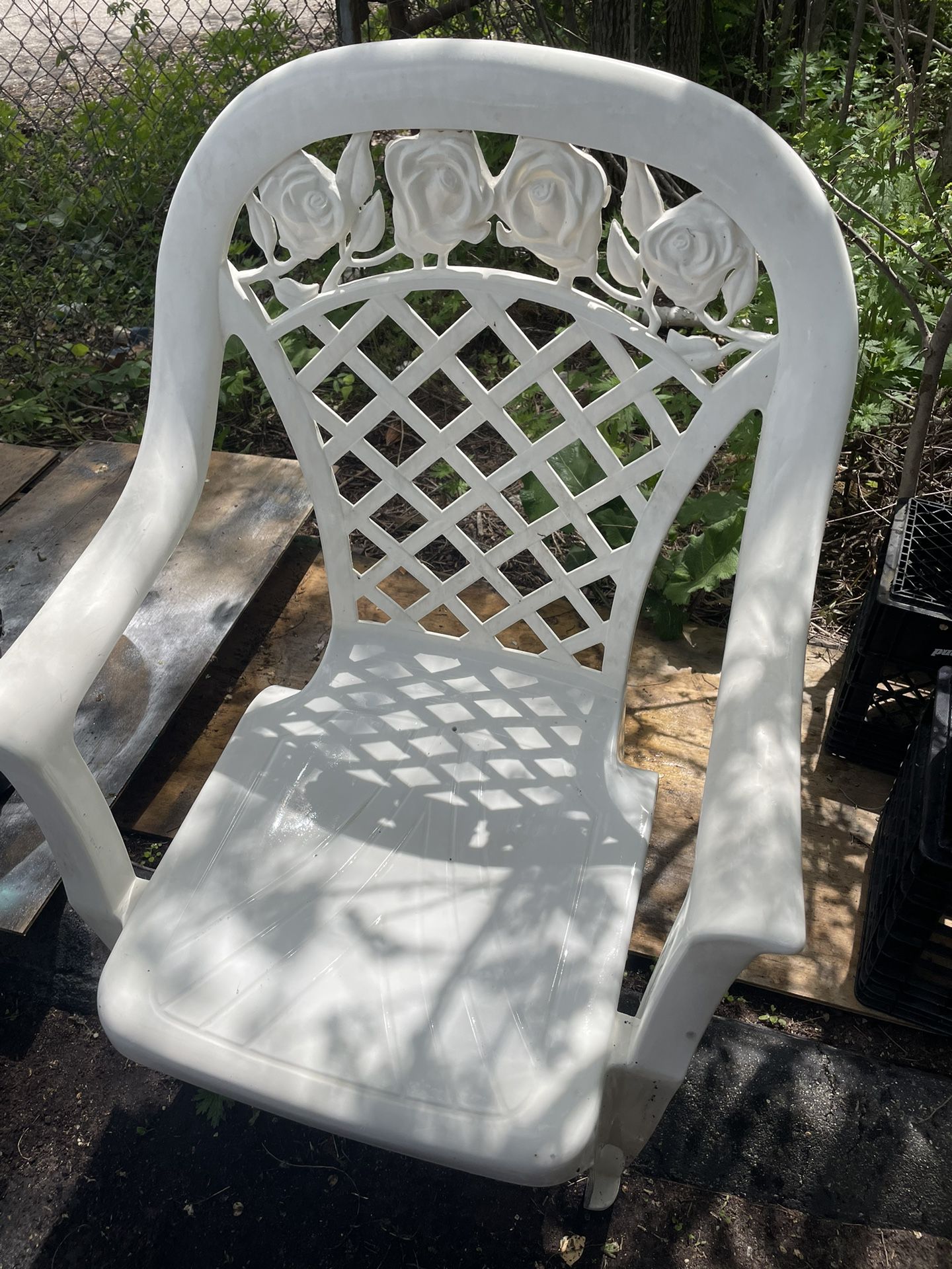 Four plastic chairs