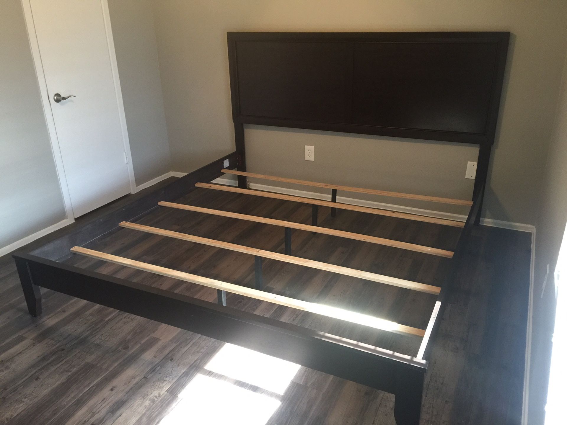 Sturdy brown wooden bed frame in perfect condition. King size