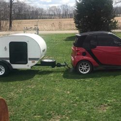 Smart Car And Little Guy Camper