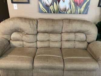 Comfortable 3-seat reclining sofa with dual recliners and built-in armrest storage!