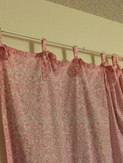 Pink /white curtains. Very pretty