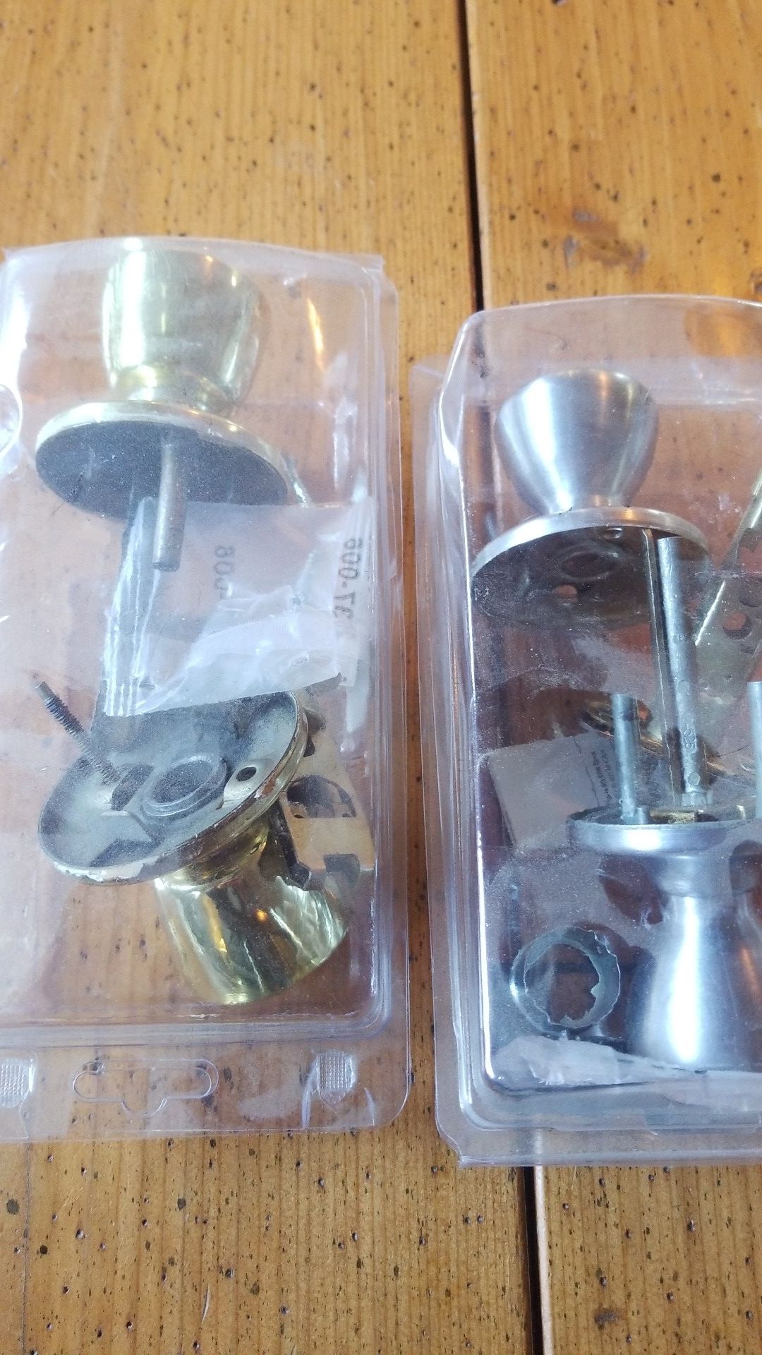 Indoor door knobs. One brass and one brushed nickle.