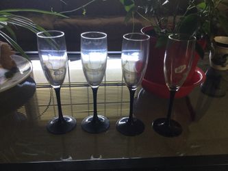 Black stemmed champagne glasses