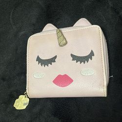 Betsey Johnson unicorn wallet in blush, featuring a gold glitter horn and a lip-shaped zipper pull.