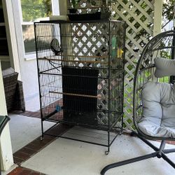 Large Bird Cage And A Smaller Cage