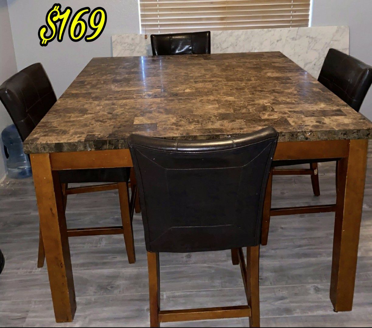 Good Condition Dining Table With Marble top Heavy Marble top Square Shape Fits 8 people Comes with 6 chairs only. Asking $169