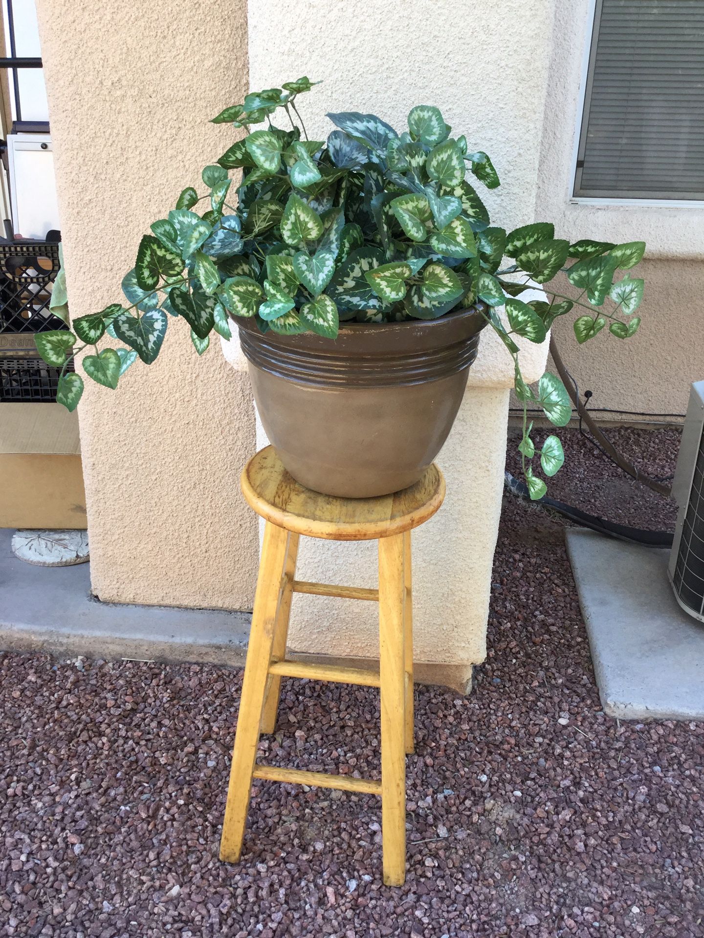 Fake plant and brown two tone plastic pot