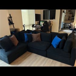 Black Plush Velvet Couch With Additional Pillows