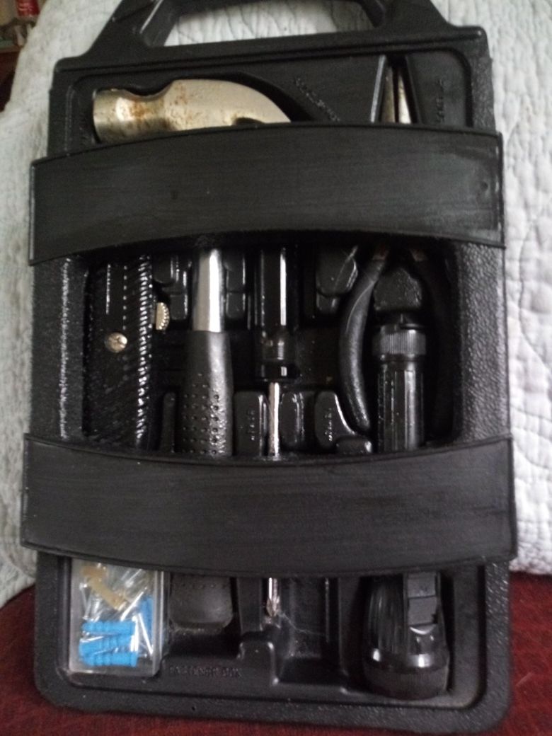 Fasteners Box. Includes hammer, box cutter, flashlight etc.