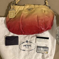 Prada Vernice Sfumata shoulder bag in red and yellow gradient patent leather.