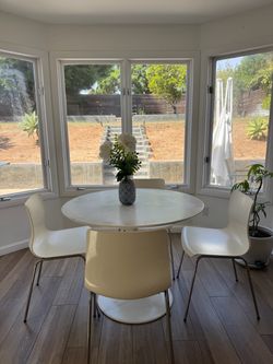 Modern white round table and chairs