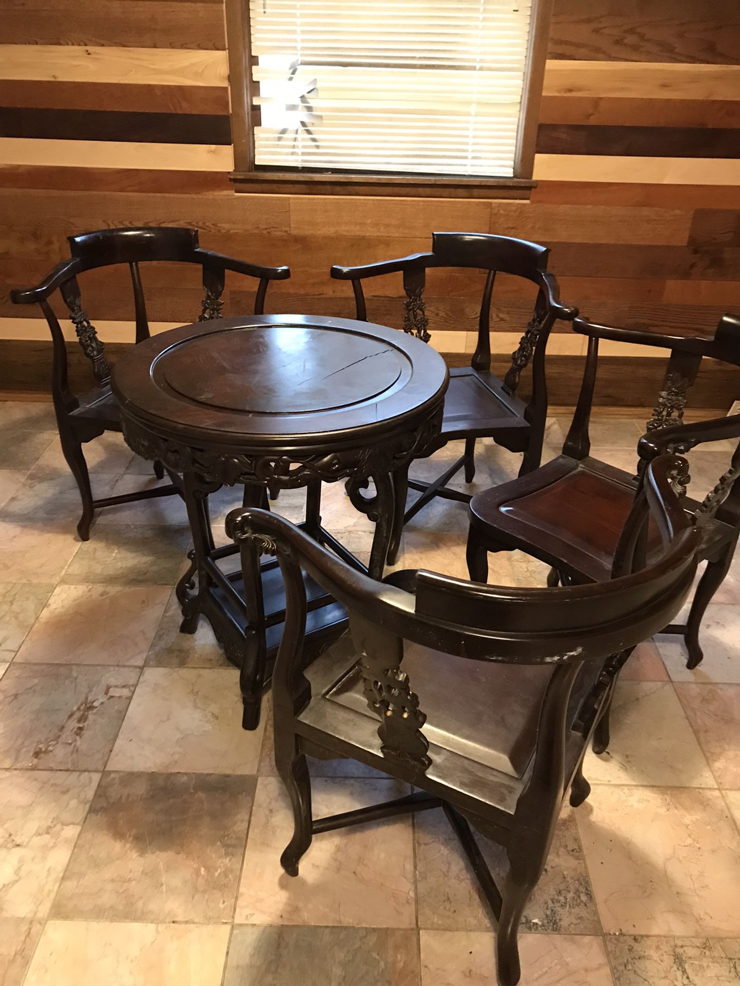 4 chairs and table with a wine rack all dark hand crafted wood