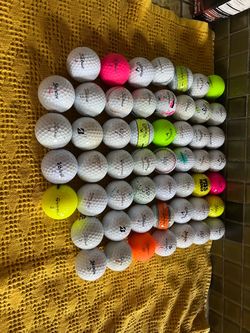 53 used mixed golf balls