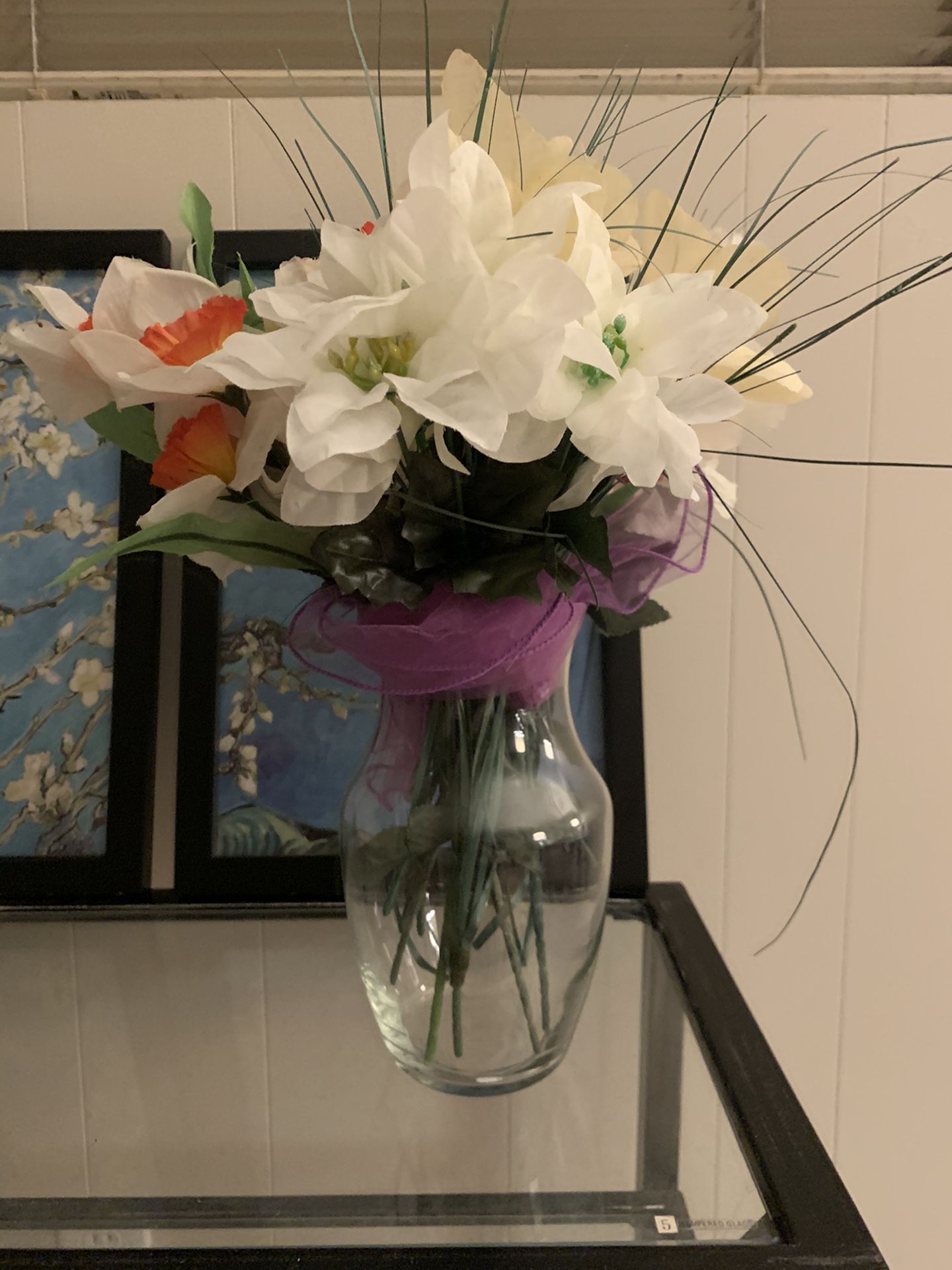 Glass flower vase and plastic flowers