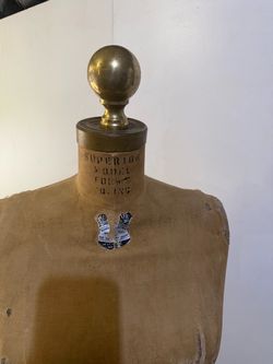 Antique dress form with wire base