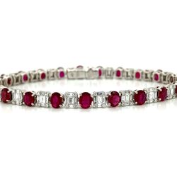 Ruby and Diamond Tennis Bracelet in 18K White Gold This bracelet is 18k white gold set with oval red rubies that have a combined total weight of 8.27 