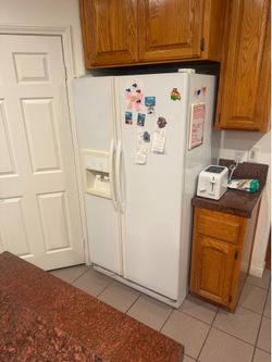 Whirlpool Side-by-Side Refrigerator Refrigerator is working. Known issues: * Water filter is difficult to replace (housing may need adjustment). * T