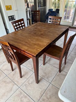 60” x 42” Dining table - 4 chairs
