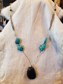 $10. Turquoise and onyx rock silvertone necklace. 23-inches.