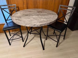 5-piece Faux Marble Pub Dining Set featuring a counter-height  pub-style table with a simulated/faux marble top, a black metal frame, and matching pad