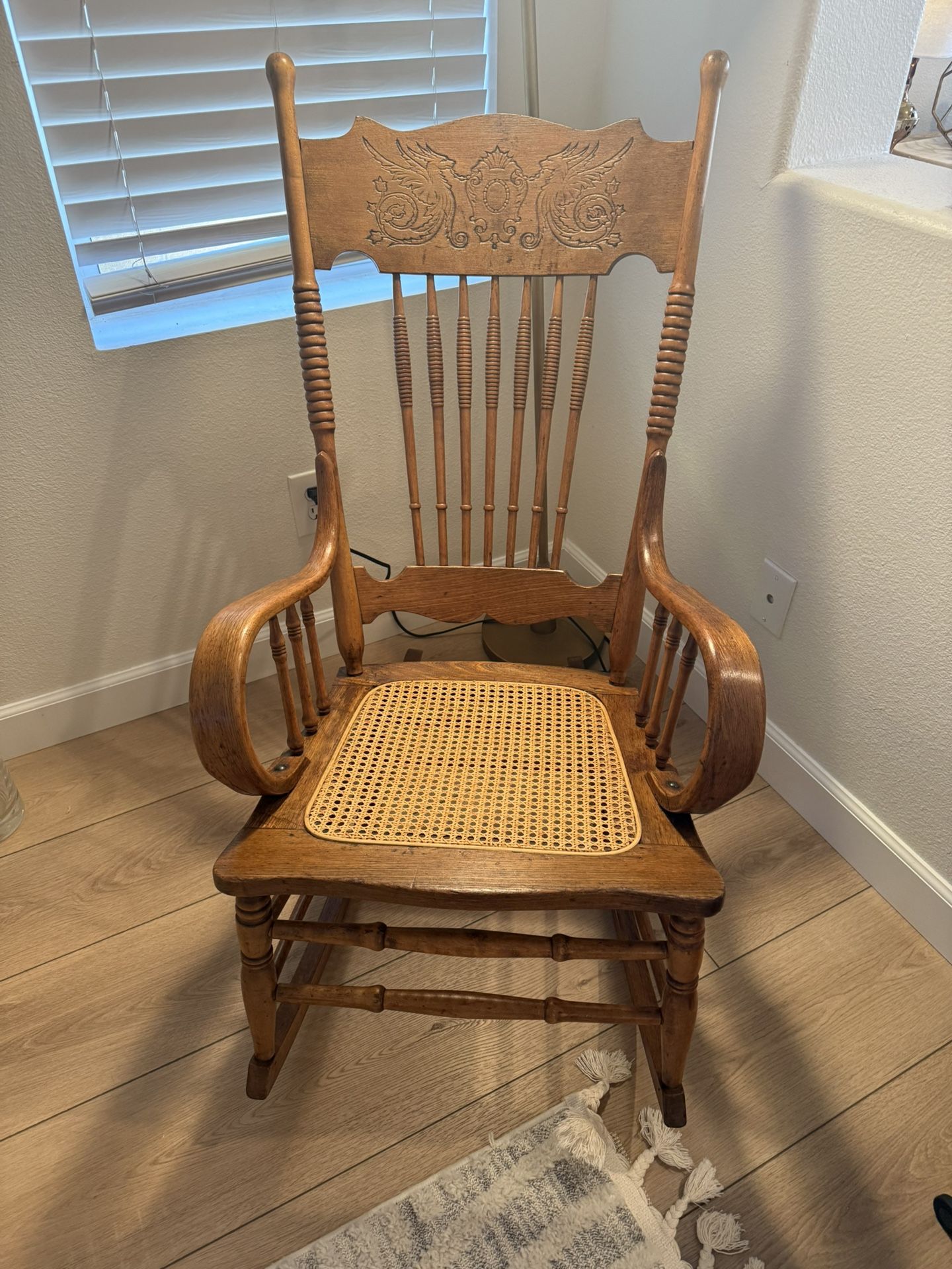 🪑 Antique Wooden Rocking Chair – Intricate Carved Back & Cane Seat
