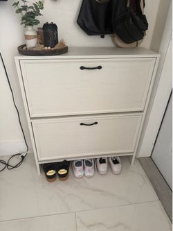 Shoe cabinet with two flip drawers