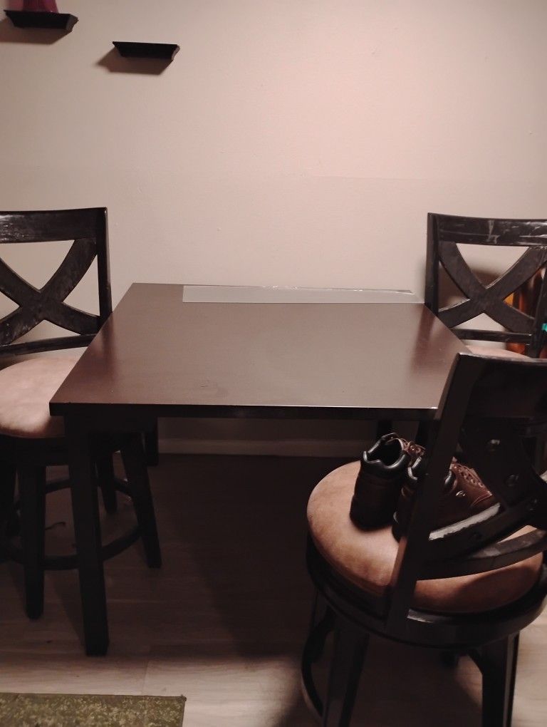 Table And Swivel Chairs 