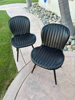Brand new faux leather chairs 2pcs