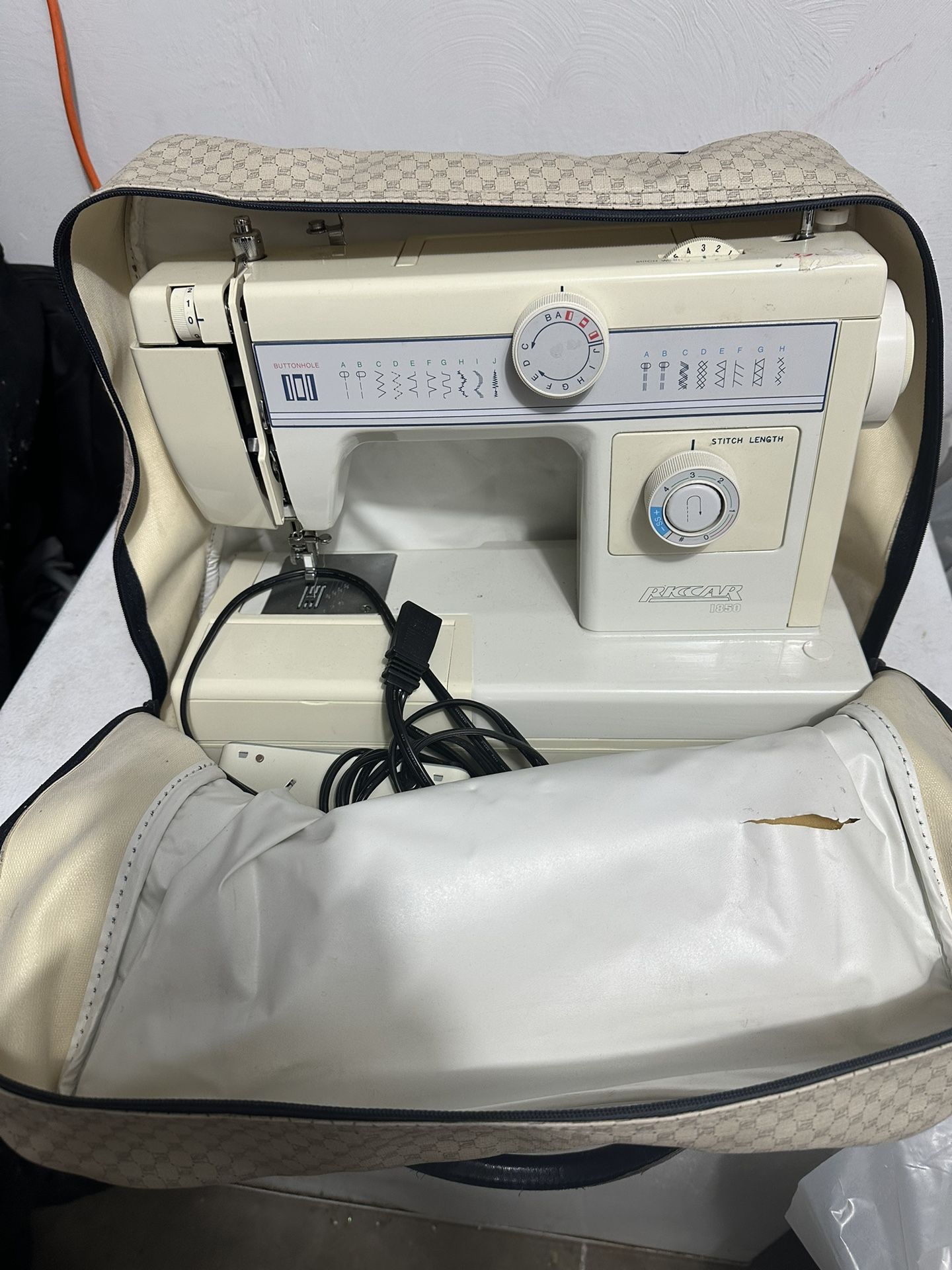 Riccar Sewing Machine with case and accessories.
