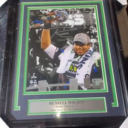 Signed Autographed Framed Pic Of Russell Wilson Holding Superbowl Trophy 