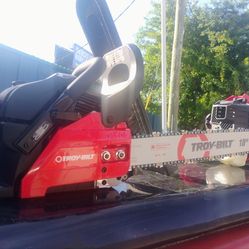 Brand new never been used Troy Bilt Chainsaw & Weedeater