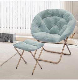 Very comfortable and spacious faux fur saucer chair with a foldable footrest—perfect for relaxing at home. Number 117 $70