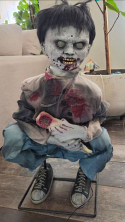 Halloween eating zombie boy