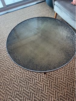 Vintage glass coffee table with iron legs