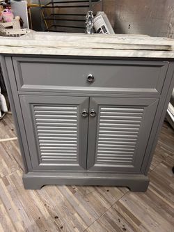 30 inch silver and grey bathroom vanity with faucet